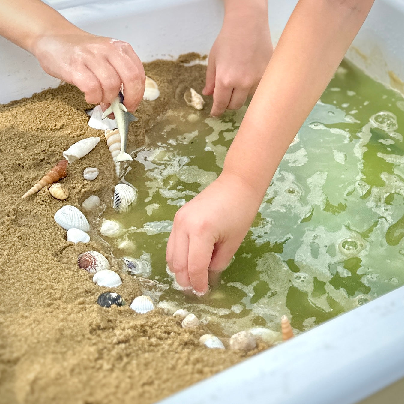 Sand and water sensory bin exploration