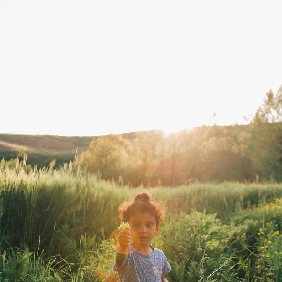 Preschool children joyfully participating in a Good Morning song activity
