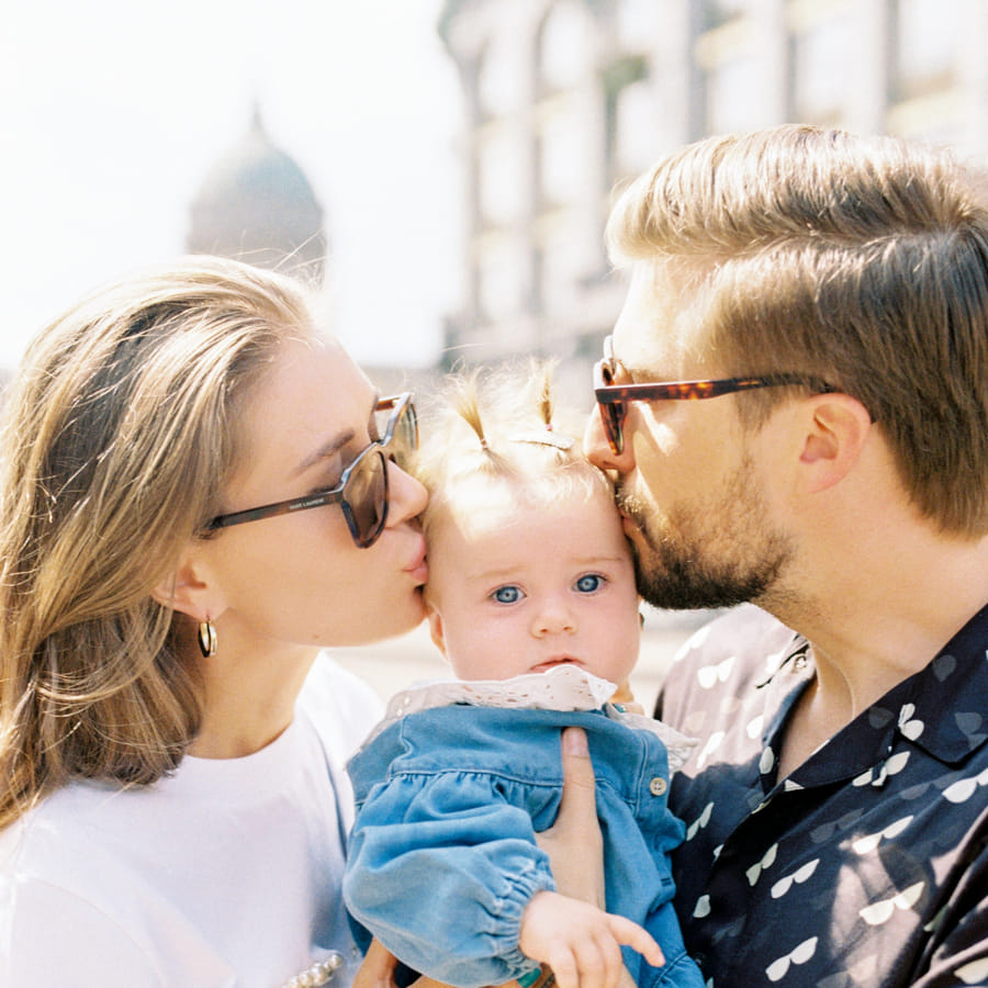 Preschooler proudly presenting his DIY Father\'s Day craft to his smiling dad