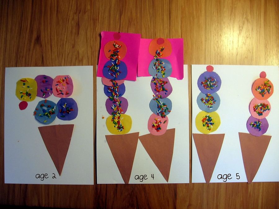 Preschool child crafting an iguana and ice cream cones using the letter I