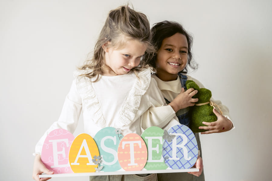 Joyful preschooler engaging with a letter recognition worksheet
