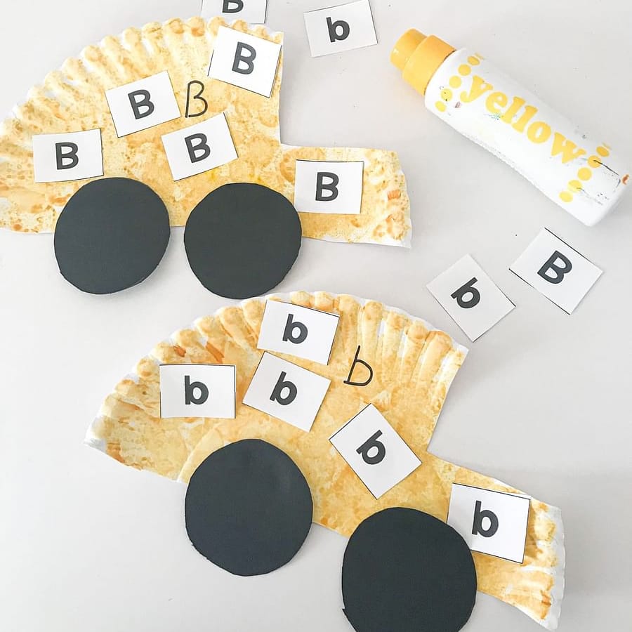 Preschool child working on a letter recognition worksheet