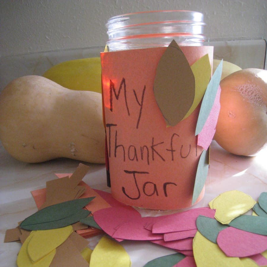 Preschooler\'s decorated Gratitude Jar for Thanksgiving craft